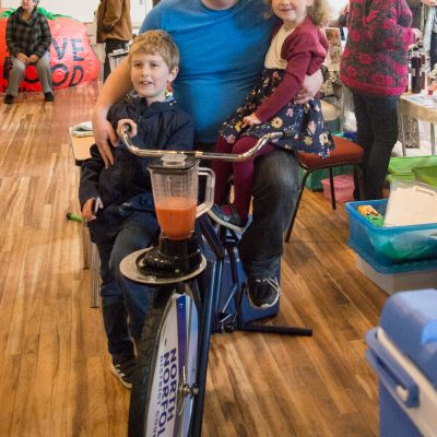 Adam Payne with his children Toby, aged eight and Sophie, four, test a Smoothie Bike.