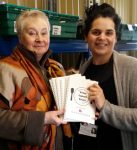 2016: Ella King (right) receives the booklets from Mo Anderson-Dungar.